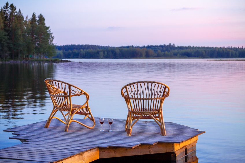 36145137 – two chairs on dock with glasses of wine